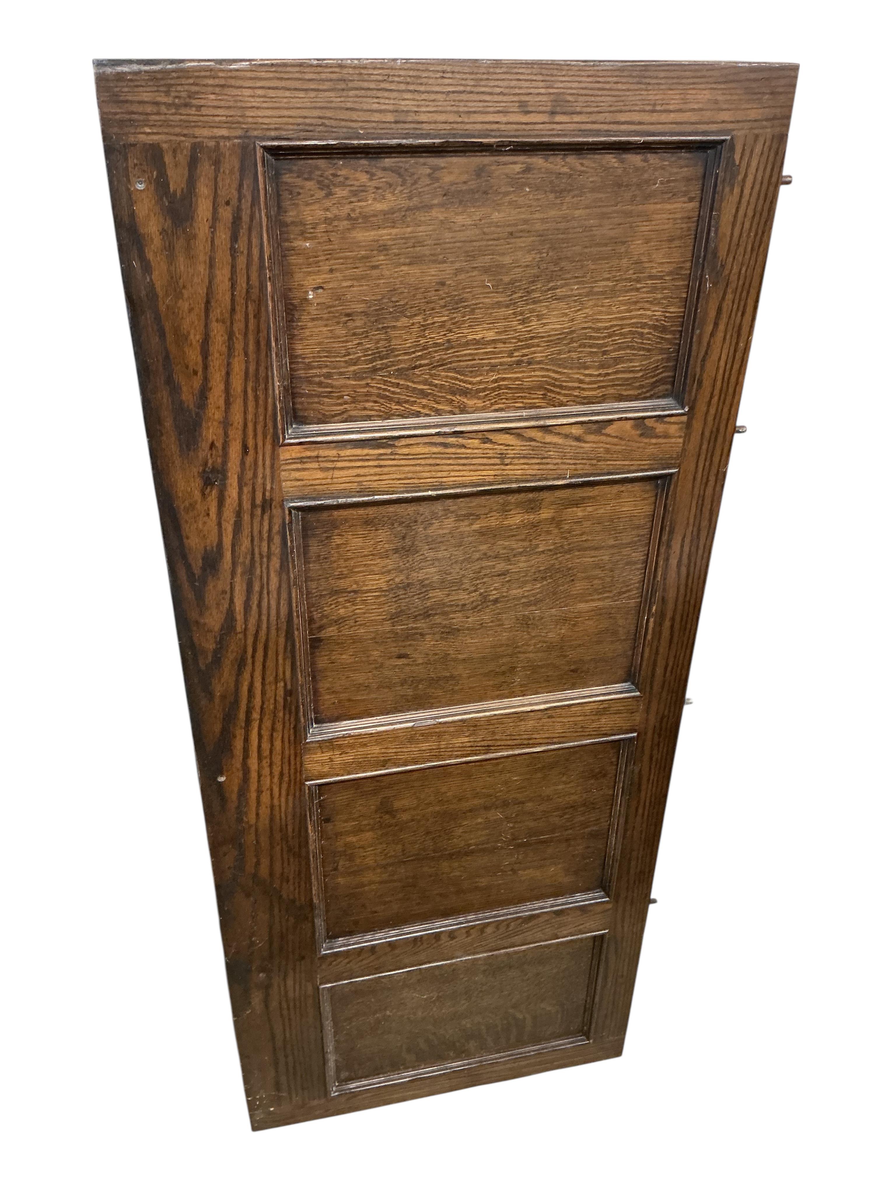 A section of oak panelling in two parts, width 184cm, height 218cm